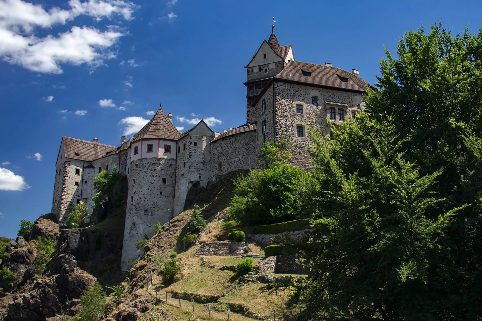 Loket Castle above the river and forest